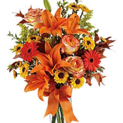 Feel the crisp beauty of fall with this wonderful bouquet.
This luscious arrangement is filled with a gorgeous assortment of autumnal hues, sure to delight your recipient with this dazzling array of rich colors and textures.