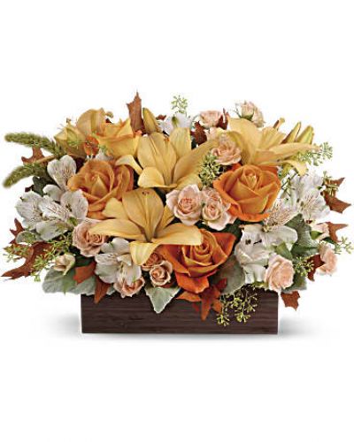 <div id="mark-3" class="m-pdp-tabs-marketing-description">Simply chic and overflowing with fall blooms! This gorgeous arrangement is sure to impress with its glorious shades of autumn - combining orange roses, peach lilies and seasonal brown leaves. Hand-delivered in a dark-toned bamboo rectangle.</div>
<p>&nbsp;</p>
<div id="desc-3">
<ul>
<li>This impressive arrangement features light orange and peach roses, peach asiatic lilies and white alstroemeria, and finished with dusty miller, seeded eucalyptus and millet.</li>
</ul>
</div>