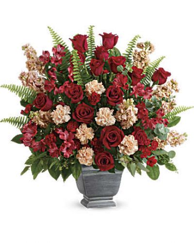 <div class="m-pdp-tabs-description">
<div id="mark-1" class="m-pdp-tabs-marketing-description">A bold expression of your deepest condolences, this elegant mix of red and peach blooms in a large antiqued pot brings strength and comfort.</div>
</div>
<p id="arrngDescp">Red roses, red alstroemeria, peach carnations, miniature red carnations, and peach stock are arranged with spiral eucalyptus, seeded eucalyptus, sword fern, and lemon leaf.</p>