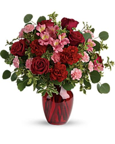 <div id="mark-3" class="m-pdp-tabs-marketing-description">Tres belle! Ruby red roses and delicate pink alstroemeria are mixed with whimsical greens in a radiant vase for a beautifully blooming gift she'll never forget!</div>
<div id="desc-3">
<ul>
<li>Red roses, pink alstroemeria, red carnations, and pink miniature carnations are accented with silver dollar eucalyptus and pitta negra.</li>
<li>Delivered in a ruby rose vase.</li>
</ul>
</div>
